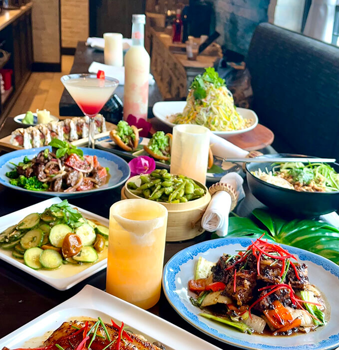 Table spread of several amazingly delicious dishes from Starfish Laguna Beach